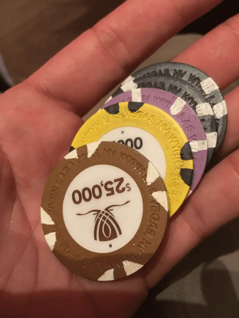 hand-holding-baccarat-chips
